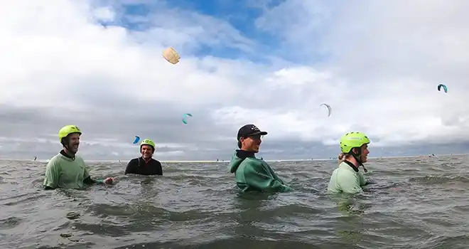 Dynamic 5-day kitesurfing course, capturing students mastering techniques and enjoying the progressive learning journey